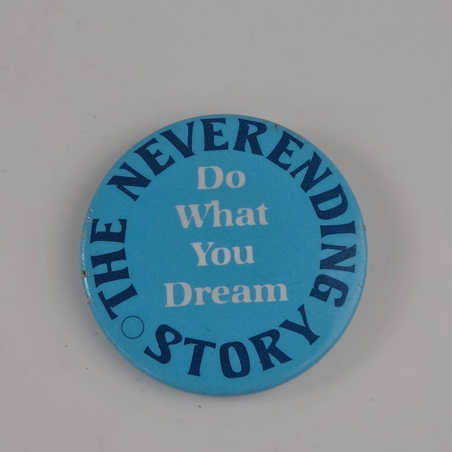 The Neverending Story Do What You Dream" promotional film pin faithful to the original