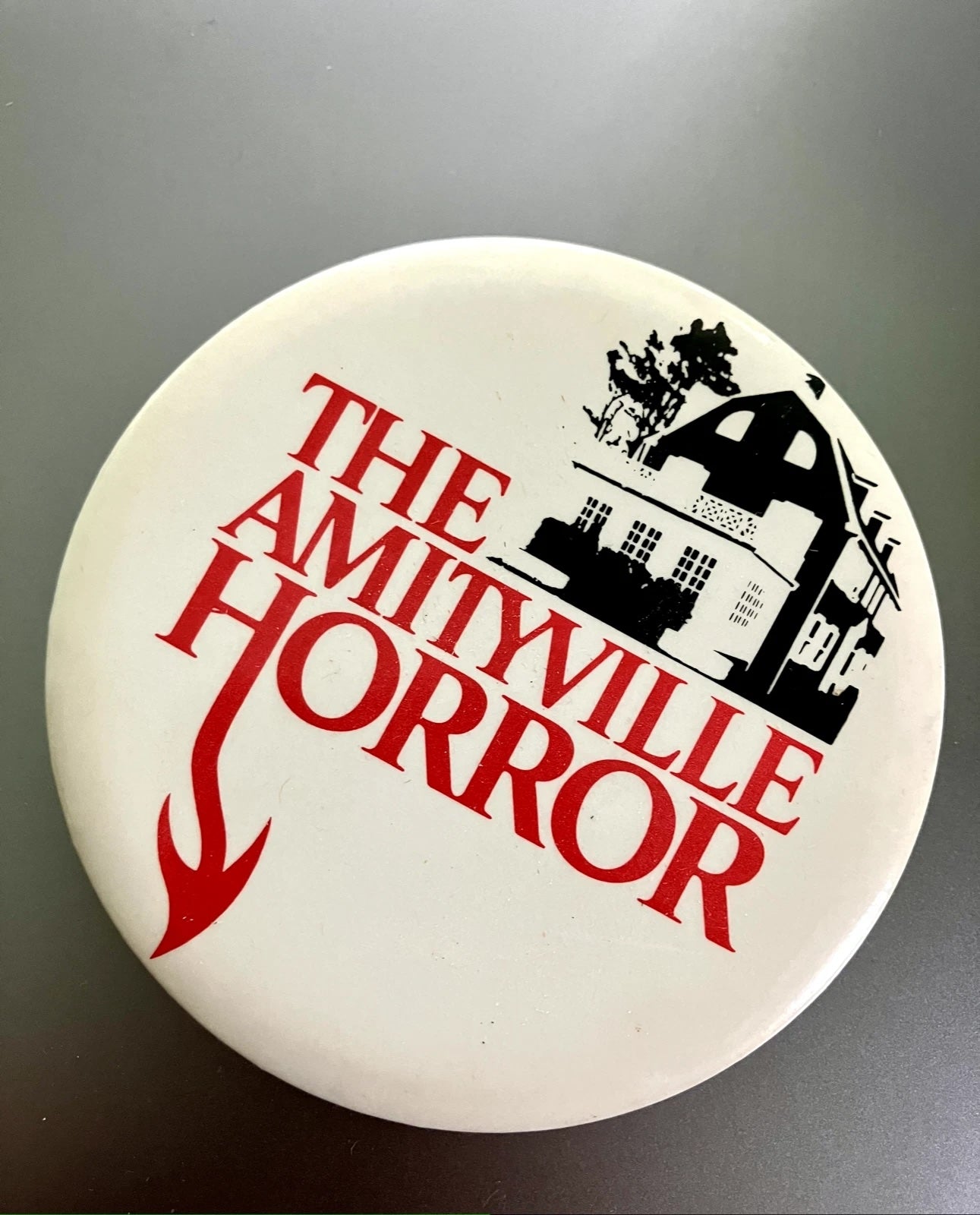 The Amityville Horror promotional button pin faithful reproduction from the original